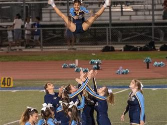 Cheerleading basket toss during halftime