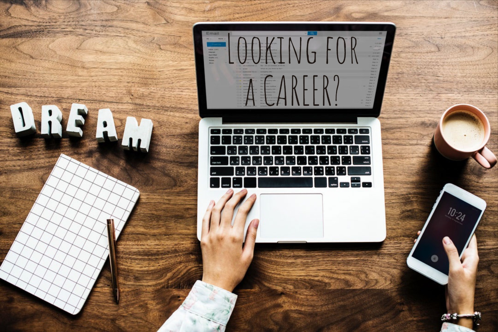 Laptop with text "looking for a career?" blocks nearby spell dream