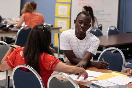 Students meeting with others in the community