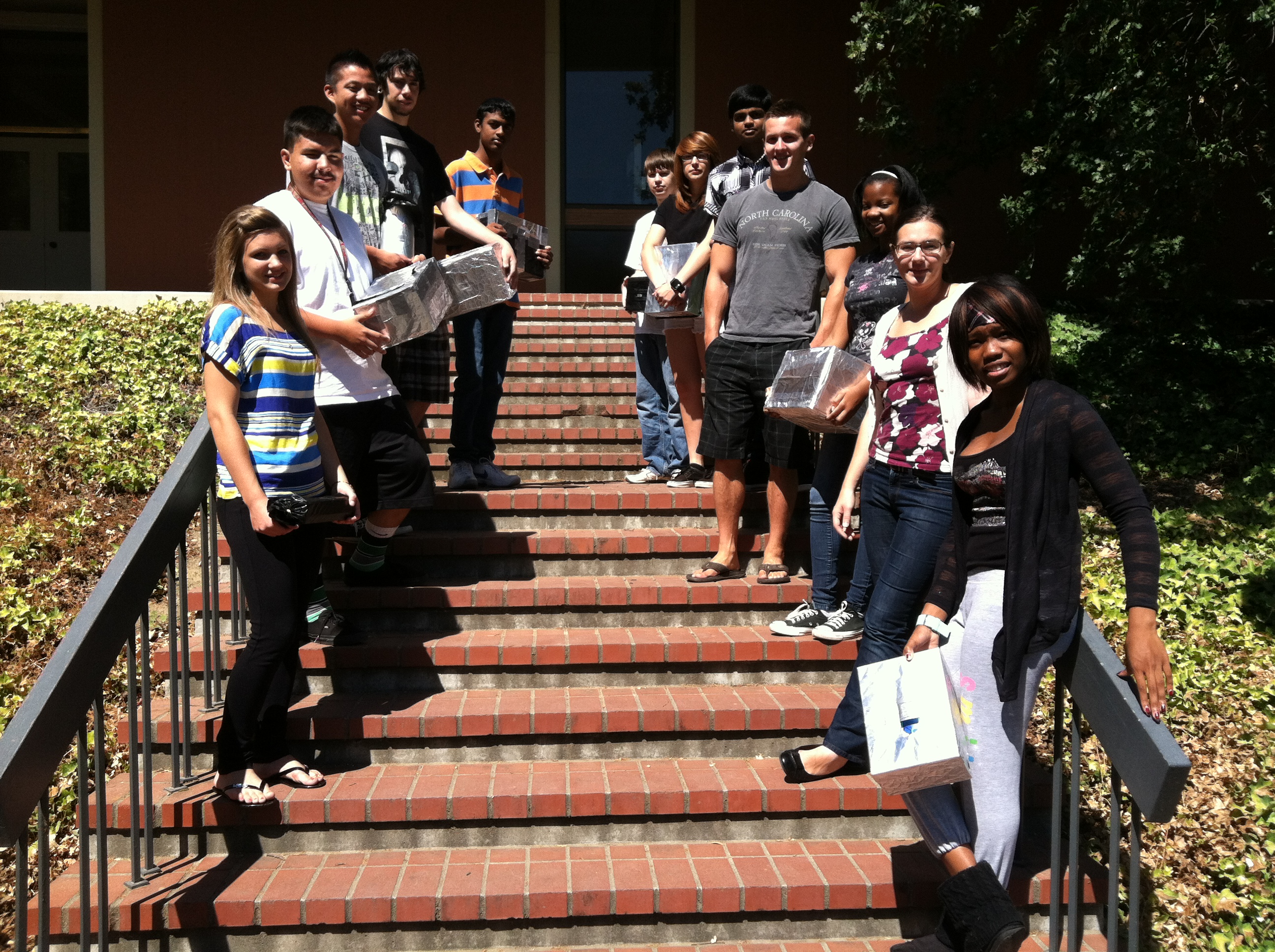 students lined up for group photo on entry steps