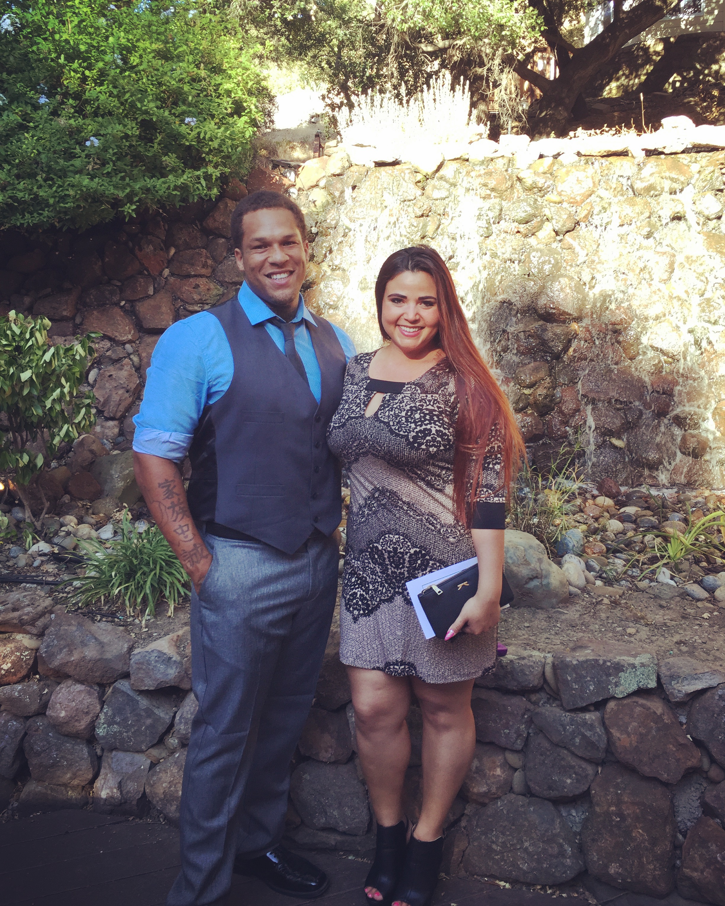 couple posing in dress clothes.