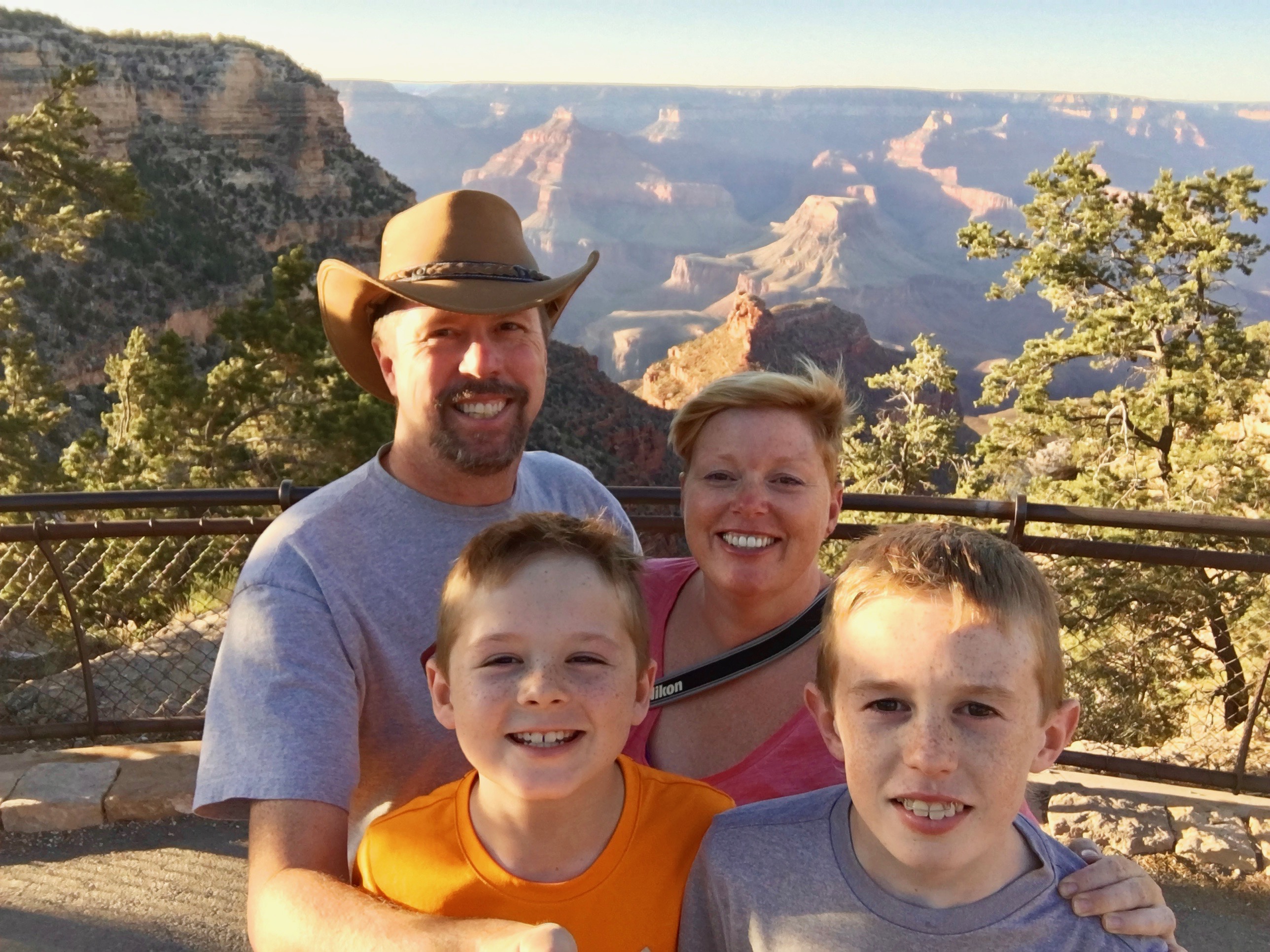 family photo in front of grand canyon